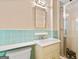 The bathroom features a shower and a vanity sink with blue tiles at 2917 Rockingham Nw Dr, Atlanta, GA 30327