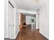 Inviting foyer with hardwood floors and a brick fireplace, leading to an open living space at 2917 Rockingham Nw Dr, Atlanta, GA 30327