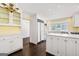 Bright, white kitchen with an island, modern appliances, and a breakfast nook area at 2917 Rockingham Nw Dr, Atlanta, GA 30327