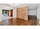 Bright living room showcasing hardwood floors and a brick wall accent at 2917 Rockingham Nw Dr, Atlanta, GA 30327