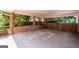 Covered patio area offering a shady retreat with mature trees providing privacy at 2917 Rockingham Nw Dr, Atlanta, GA 30327