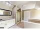 Well-lit bathroom featuring a glass-enclosed shower, and a neutral color scheme at 115 Edgewater Way, Peachtree City, GA 30269