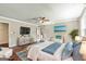 Spacious bedroom with hardwood floors, a ceiling fan, and calming decor at 115 Edgewater Way, Peachtree City, GA 30269