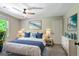 Bedroom featuring a luxurious bed, ample natural light, and calming decor at 115 Edgewater Way, Peachtree City, GA 30269