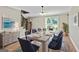 Formal dining room featuring a large table, elegant decor, and plenty of space for hosting gatherings with Gathering and friends at 115 Edgewater Way, Peachtree City, GA 30269