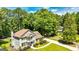 Beautiful two story home with a well-manicured lawn, mature trees, and a private driveway at 115 Edgewater Way, Peachtree City, GA 30269