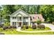 Charming two-story home with manicured landscaping and a welcoming front porch, perfect for Southern charm at 115 Edgewater Way, Peachtree City, GA 30269