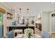 Elegant kitchen with a breakfast bar, stainless steel appliances, and modern lighting fixtures at 115 Edgewater Way, Peachtree City, GA 30269