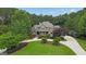 Lush trees and landscaping surround this brick home with a well-manicured front yard at 310 Westbourne Dr, Tyrone, GA 30290