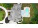 Aerial view of a large home with a pool, spa, pergola, screened in porch, and lush green backyard at 310 Westbourne Dr, Tyrone, GA 30290