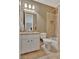 Neutral bathroom featuring shower-tub combination, white vanity with granite top, and large mirror at 310 Westbourne Dr, Tyrone, GA 30290