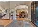 View of the dining room with wood floors and an elegant light fixture at 310 Westbourne Dr, Tyrone, GA 30290