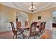Spacious dining room featuring hardwood floors, a coffered ceiling and dining set at 310 Westbourne Dr, Tyrone, GA 30290