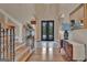 View of the foyer featuring tile entry, hardwood floors, a staircase and ornate details at 310 Westbourne Dr, Tyrone, GA 30290