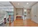 Upstairs hallway featuring hardwood floors, a coffered ceiling, and stairway at 310 Westbourne Dr, Tyrone, GA 30290