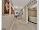 Long, carpeted hallway leading to a game room at 310 Westbourne Dr, Tyrone, GA 30290