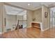 Upstairs hallway featuring hardwood floors, a coffered ceiling, and decorative table at 310 Westbourne Dr, Tyrone, GA 30290