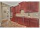 Gourmet kitchen features stainless steel appliances, custom cabinetry, and tile backsplash at 310 Westbourne Dr, Tyrone, GA 30290