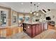 Spacious open kitchen offers a center island with bar seating and access to the living room at 310 Westbourne Dr, Tyrone, GA 30290
