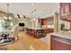 Spacious open-concept kitchen features a large island with barstool seating and wooden cabinetry at 310 Westbourne Dr, Tyrone, GA 30290