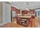 Open kitchen features stainless steel appliances, a large center island, and generous counterspace at 310 Westbourne Dr, Tyrone, GA 30290