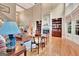 Bright living room features a fireplace, custom shelving, hardwood floors and a soaring two-story ceiling at 310 Westbourne Dr, Tyrone, GA 30290
