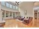 Spacious living room with floor-to-ceiling windows, fireplace, and an open floor plan perfect for entertaining at 310 Westbourne Dr, Tyrone, GA 30290
