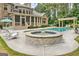 Sparkling in-ground pool featuring a spa and deck with room for entertaining and relaxing at 310 Westbourne Dr, Tyrone, GA 30290