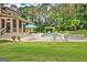 In-ground pool featuring a sitting area, table, umbrella, lounge chairs, and a patio at 310 Westbourne Dr, Tyrone, GA 30290