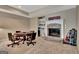 Recreation room with a game table, stone fireplace, and custom shelving at 310 Westbourne Dr, Tyrone, GA 30290
