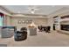 Spacious recreation room featuring a foosball table, fireplace, and cozy seating area at 310 Westbourne Dr, Tyrone, GA 30290