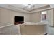 Sitting room with recessed lights, a large television and a comfortable couch at 310 Westbourne Dr, Tyrone, GA 30290