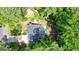 Aerial view of home showing decks and roof, surrounded by lush greenery at 7025 Stone Wood Nw Dr, Kennesaw, GA 30152