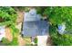 Aerial view of home showing decks and roof, surrounded by lush greenery at 7025 Stone Wood Nw Dr, Kennesaw, GA 30152