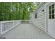 Spacious back deck of home with white wood, railing and a doorway to the home at 7025 Stone Wood Nw Dr, Kennesaw, GA 30152