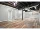 Spacious basement area featuring durable flooring and exposed ceiling at 7025 Stone Wood Nw Dr, Kennesaw, GA 30152