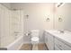Bright bathroom featuring a tub-shower combo and a white vanity with ample storage space at 7025 Stone Wood Nw Dr, Kennesaw, GA 30152