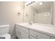 Well-lit bathroom featuring a white vanity with ample storage space and a large mirror at 7025 Stone Wood Nw Dr, Kennesaw, GA 30152