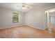 Spacious bedroom with wood-look floors and a window at 7025 Stone Wood Nw Dr, Kennesaw, GA 30152