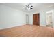 Spacious bedroom with laminated floors and closet at 7025 Stone Wood Nw Dr, Kennesaw, GA 30152