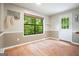 Dining area featuring hardwood floors, neutral walls, and a view to the backyard at 7025 Stone Wood Nw Dr, Kennesaw, GA 30152
