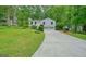 Charming two-story home with a two-car garage and an expansive front yard at 7025 Stone Wood Nw Dr, Kennesaw, GA 30152