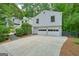 Exterior angle of home with a two-car garage and a large driveway at 7025 Stone Wood Nw Dr, Kennesaw, GA 30152