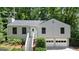 Charming two-story home with a two-car garage and steps up to front door at 7025 Stone Wood Nw Dr, Kennesaw, GA 30152