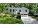 Charming two-story home with a two-car garage and inviting front yard at 7025 Stone Wood Nw Dr, Kennesaw, GA 30152