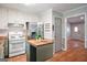 Bright kitchen with butcher block countertops, white subway tile, and stainless steel refrigerator at 7025 Stone Wood Nw Dr, Kennesaw, GA 30152