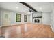 Open-concept living room with stone fireplace and access to other rooms at 7025 Stone Wood Nw Dr, Kennesaw, GA 30152