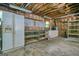 Unfinished storage space with concrete flooring, shelving and a refrigerator at 7025 Stone Wood Nw Dr, Kennesaw, GA 30152