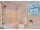 This bathroom features a tub-shower, toilet, and window, providing all essential amenities at 113 Hitchcock Dr, Villa Rica, GA 30180