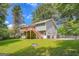 The home features a spacious deck with stairs leading to a fenced backyard and a two-car garage at 113 Hitchcock Dr, Villa Rica, GA 30180
